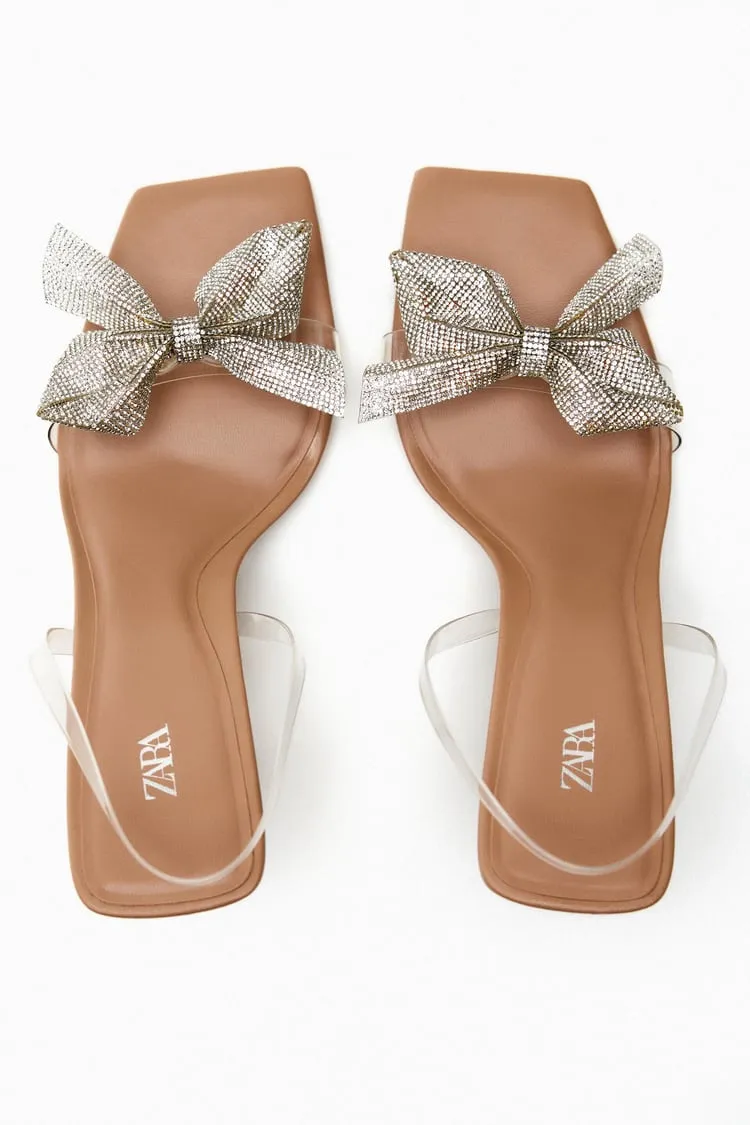 HEELED VINYL SANDALS WITH BOW